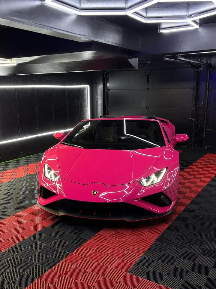 Pink Lamborghini Huracán EVO Spyder under the studio lights